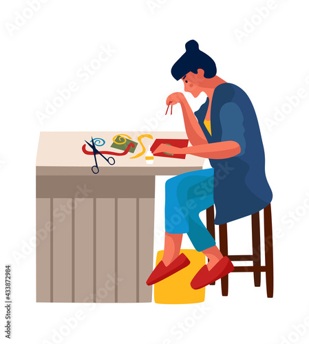 Woman at home. Cartoon female embroiders or glues applique. Character sits at table and cuts with scissors. Girl doing handicrafts. Person spends leisure time in apartment. Vector hobby