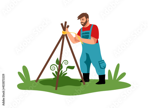 Planting. Cartoon man working in garden. Agricultural worker building wooden construction for plant protection. Male character takes care of seedlings. Vector gardener grows bushes