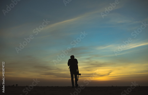 silhouette of a person standing on salt dessert 