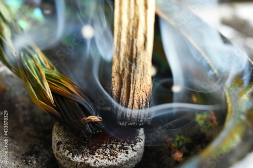 Obraz na plátně A top view image of smoldering incense sticks in an abalone shell