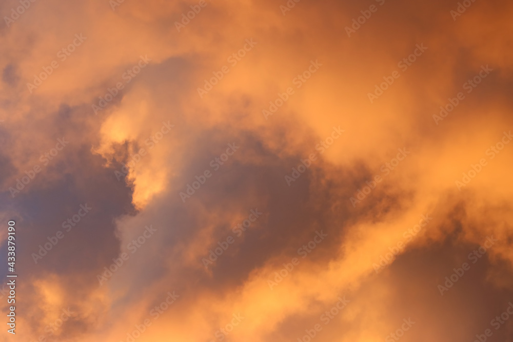 Fototapeta premium Clouds illuminated at sunrise.