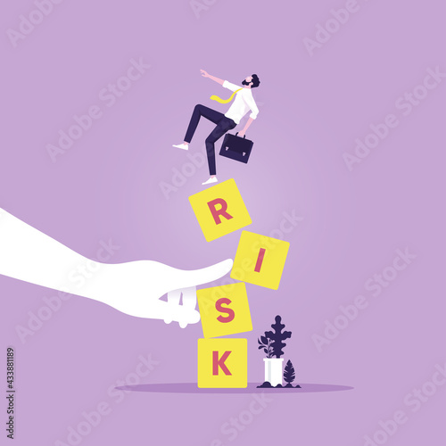 Businessman standing on shaky risk blocks by hand of enemy,Stability or balance of economics and investment, Investment risk concept © treety