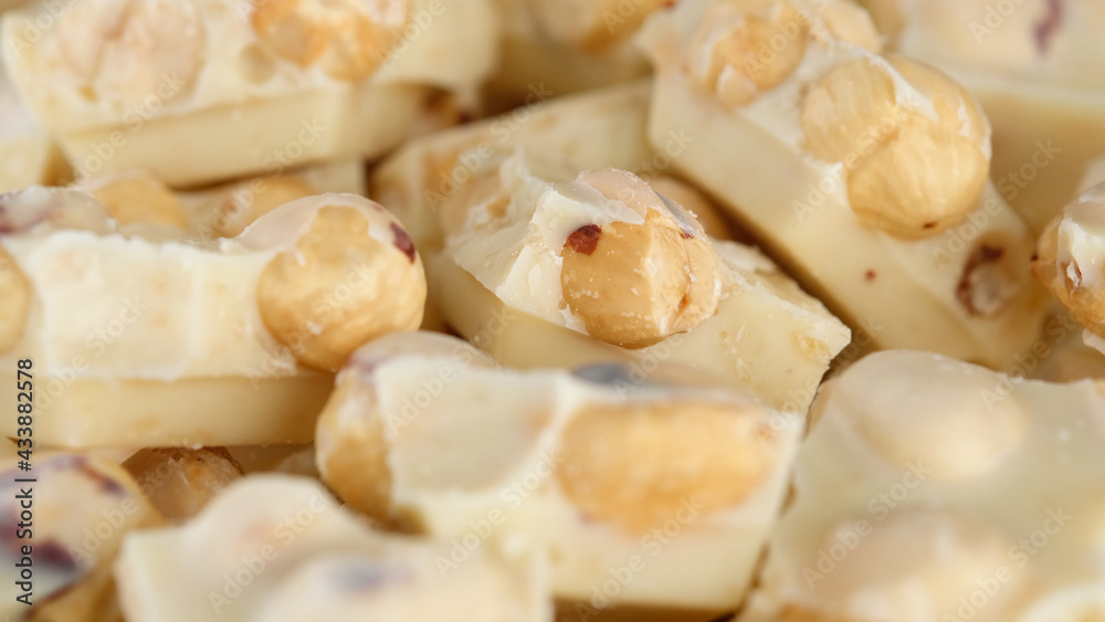 crushed white chocolate with nuts close up crushed white chocolate with nuts close up
