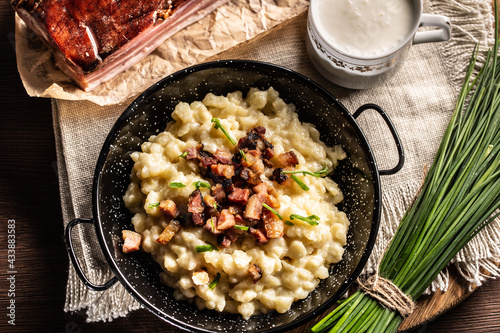 Fotografía Top view of the gnocchi with cheese food halusky with sour milk and a bunch of c