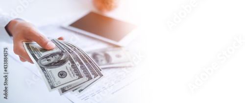 Obraz na plátně Businessman with money in hand, US dollar,investment, success and profitable business concepts