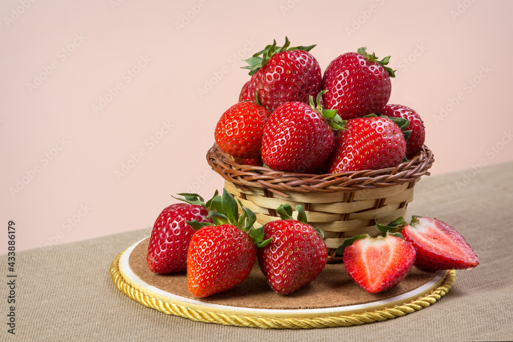 Fresh strawberries in a wicker basket Fresh strawberries in a wicker basket