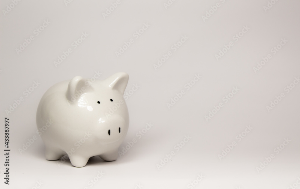Piggybank white small On saving and investing, financial and banking