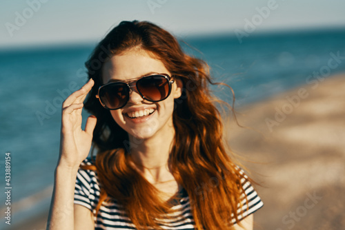 young traveler sunglasses portrait closeup sea landscape beach © SHOTPRIME STUDIO