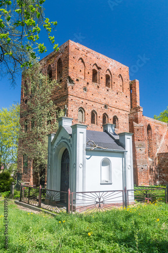 The tomb of the Wessel family and ruins of a 14th century gothic church in Steblewo, Poland. I am a guest on earth inscription on German language on chapel. photo