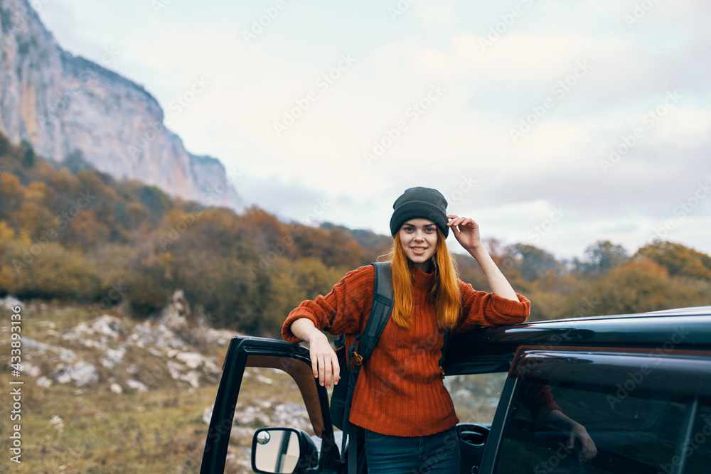 cheerful woman tourist near car travel vacation fun