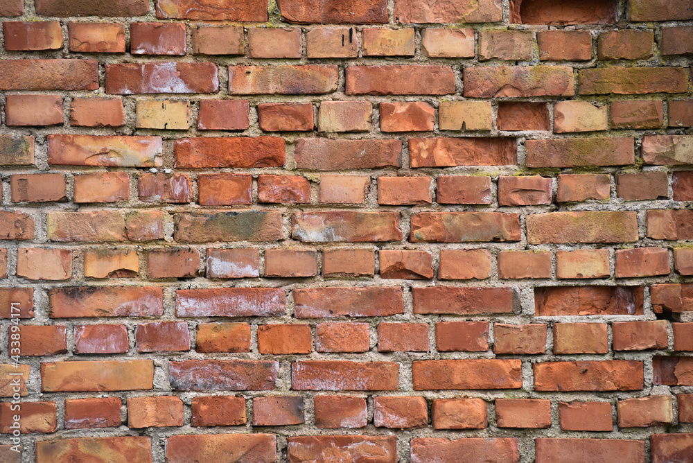 Red Brick wall with patches Red Brick wall with patches