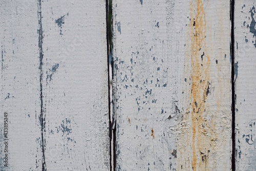 Old wooden fence with peeling paint