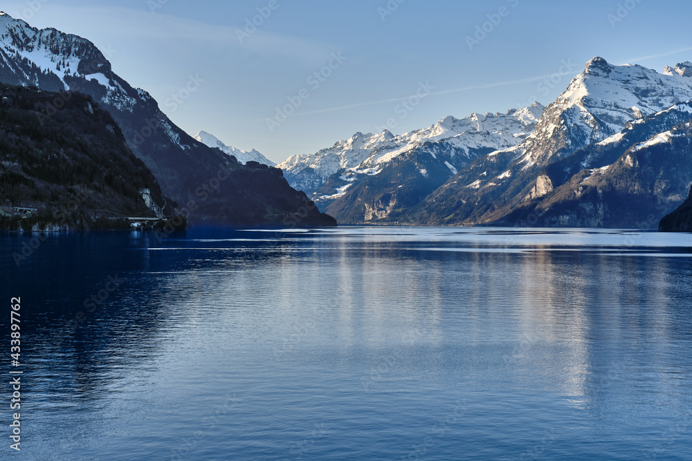 Scenic View Of Lake And Snowcapped Montains Against Sky