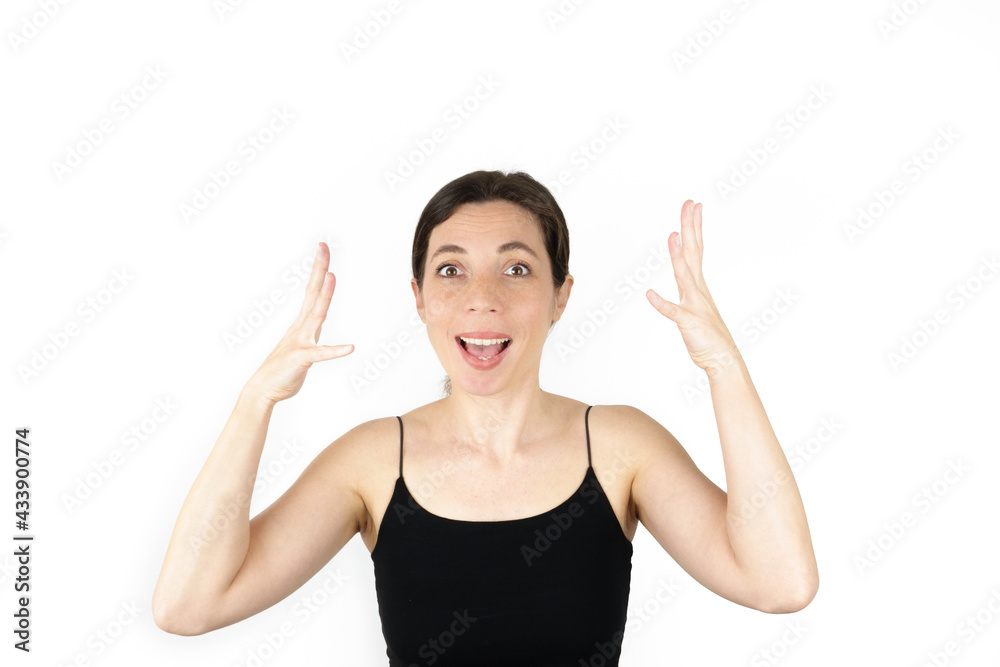 Young beautiful woman pointing up with fingers while thinking at white empty background Young beautiful woman pointing up with fingers while thinking at white empty background