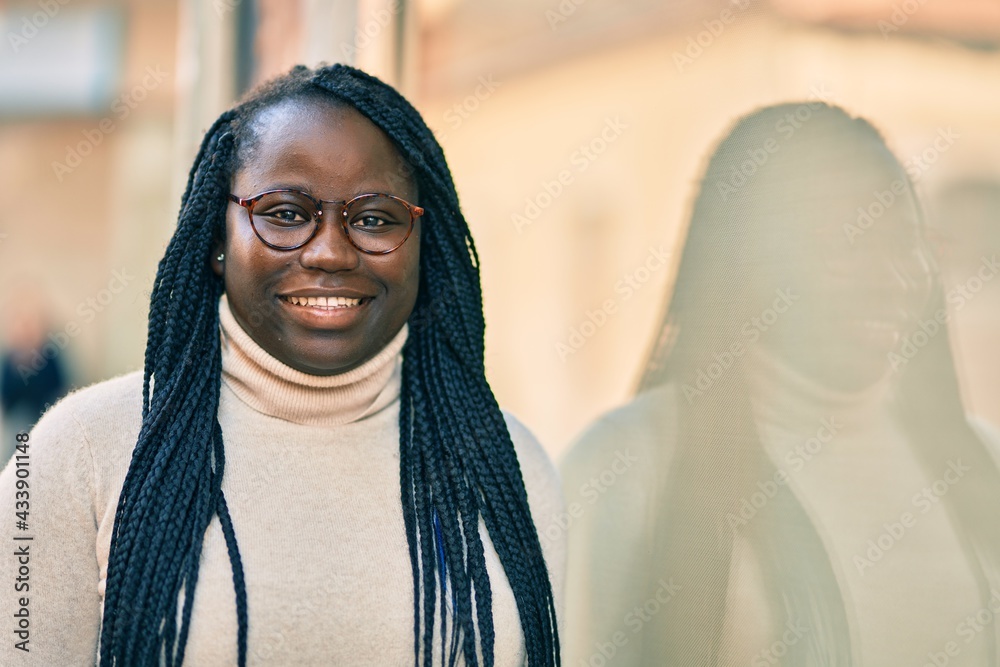 Young african american woman smiling happy standing at the city. Young african american woman smiling happy standing at the city.