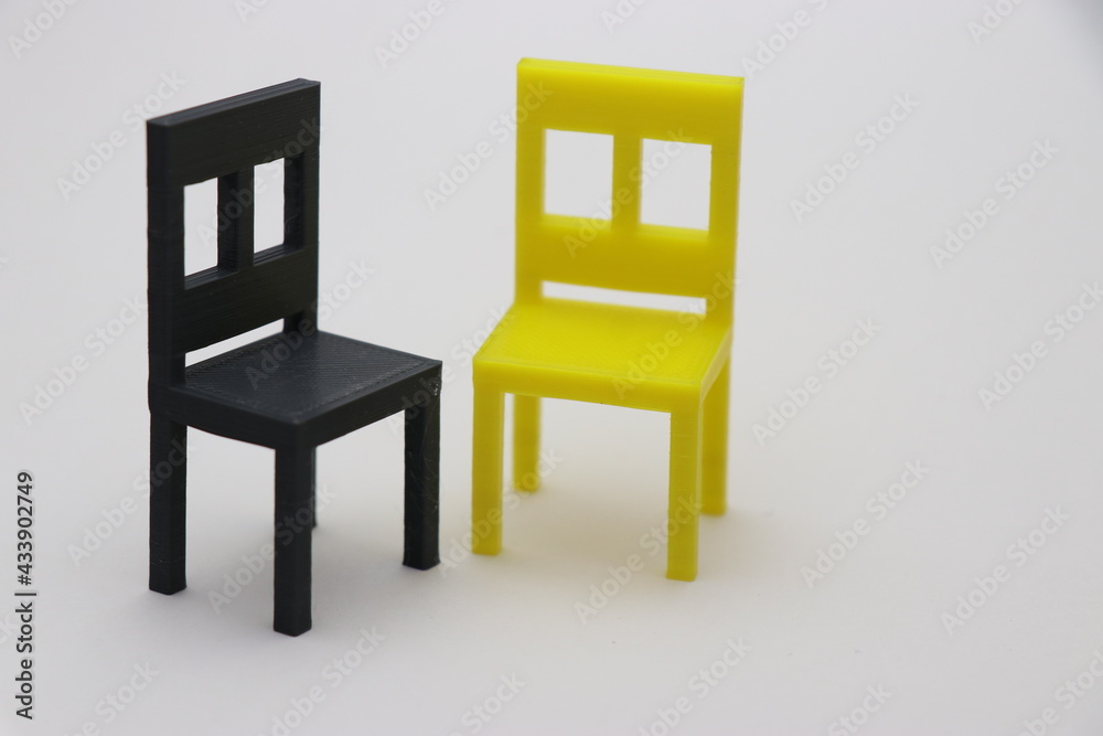3D Printed small chairs on white background. 3D Printing technology objects 3D Printed small chairs on white background. 3D Printing technology objects