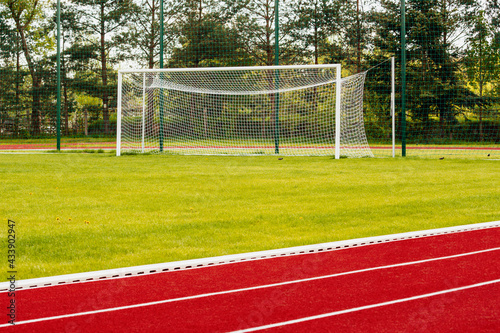 Outdoor running track with behind soccer gate