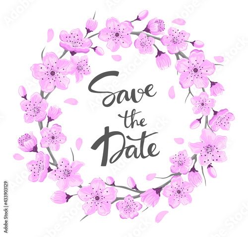 save the date hand written text and cherry blossom wreath