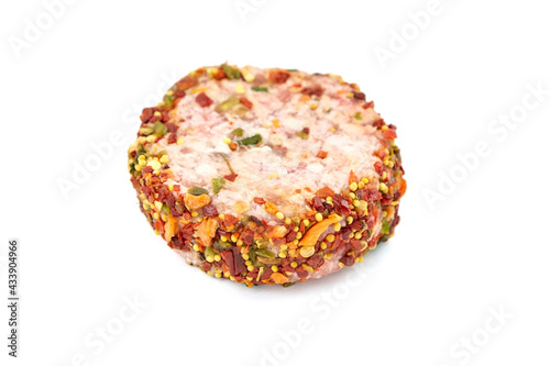 Raw meat patty with spices, pork cutlet isolated on white