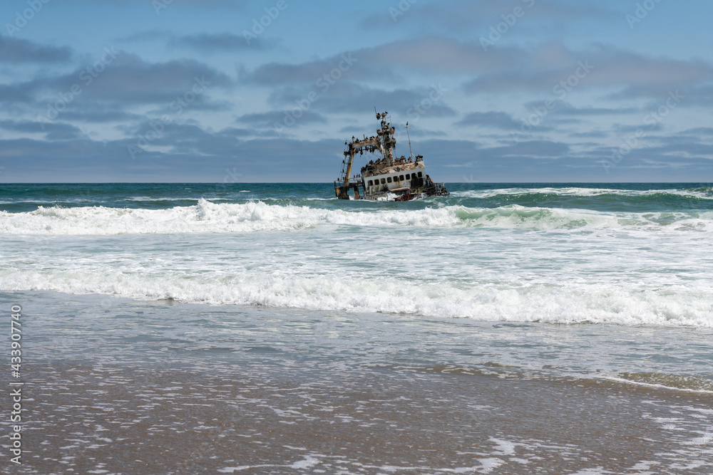 Shipwreck Zeila, an old fishing trawler, colonized by cormorants, south of Henties Bay, Skeleton Coast, Namibia. Shipwreck Zeila, an old fishing trawler, colonized by cormorants, south of Henties Bay, Skeleton Coast, Namibia.