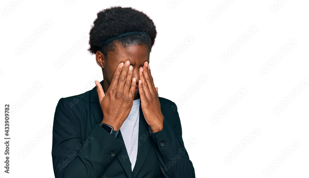 Young african american girl wearing business clothes rubbing eyes for fatigue and headache, sleepy and tired expression. vision problem Young african american girl wearing business clothes rubbing eyes for fatigue and headache, sleepy and tired expression. vision problem