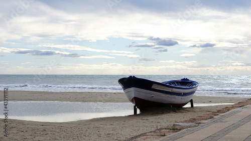 cheap wooden boat on the beach