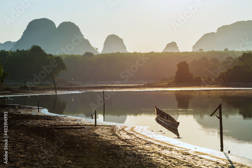 Boat on Nong Talae lake at sunrise, Krabi photo