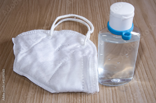 bottle of sanitizer and face mask photo