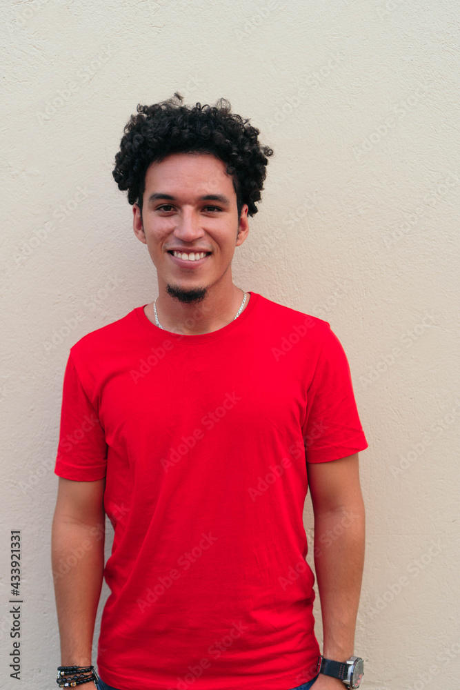 Portrait of smiling Hispanic man in red t-shirt Portrait of smiling Hispanic man in red t-shirt