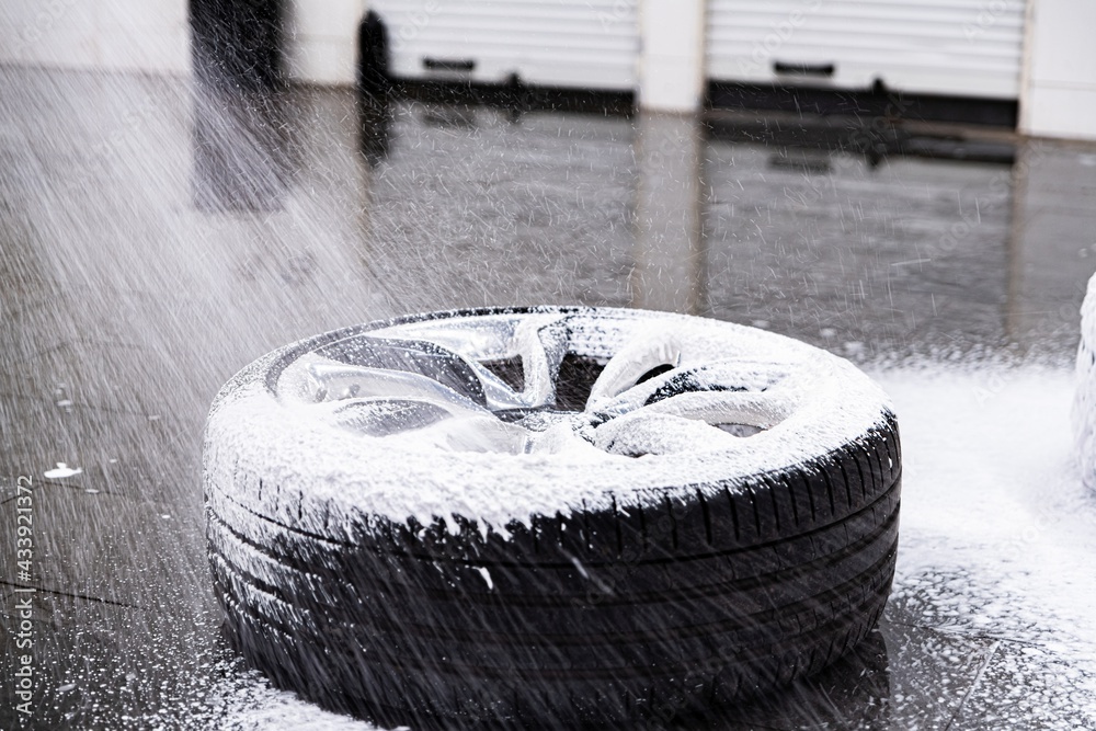 Cleaning car wheel and tire with active foam and pressure washer