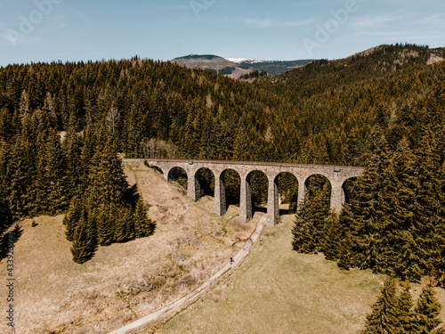 Historic railway viaduct situated in the forest near Telgart in Slovakia Aerial view. Chmarossky viadukt. Slovakia landscape. photo