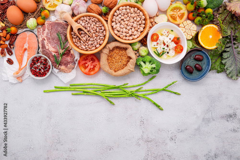 Ketogenic low carbs diet concept. Ingredients for healthy foods selection set up on white concrete background.