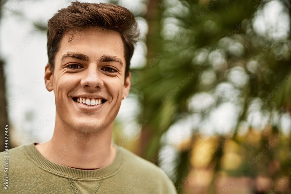 Young hispanic man smiling happy standing at the city. Young hispanic man smiling happy standing at the city.