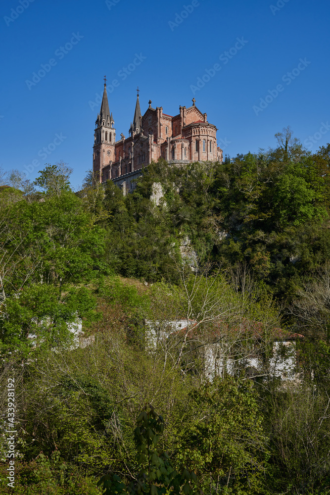 Basilica of Santa María la Real de Covadonga (Cuadonga) in Asturias (Asturies). Neo-Romanesque style temple designed by Roberto Frassinelli and built entirely in pink limestone.