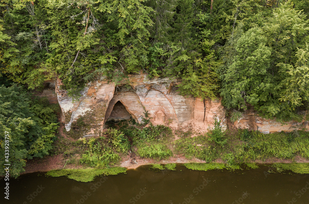 Boat trip down the river Salaca. Beautiful sand stone cliffs, Latvia. Captured from above.