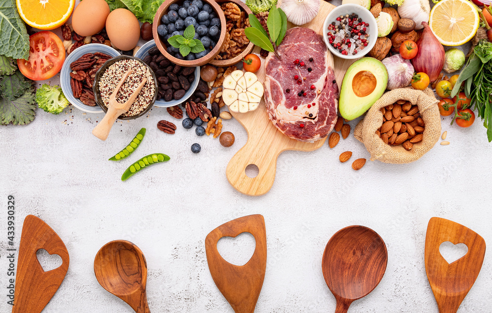 Fototapeta premium Ketogenic low carbs diet concept. Ingredients for healthy foods selection set up on white concrete background.