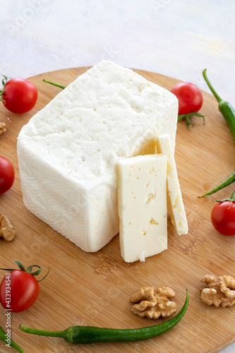 Ripe cow cheese on wooden background