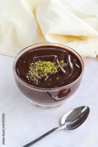 chocolate pudding on wooden background. Local name Supangle photo