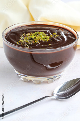 chocolate pudding on wooden background. Local name Supangle photo