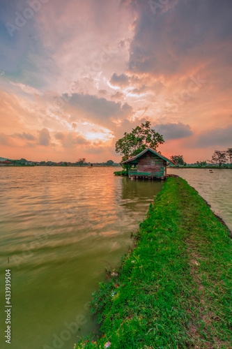 View of cottage and lake at sunset in Cikoneng - Bandung city. photo