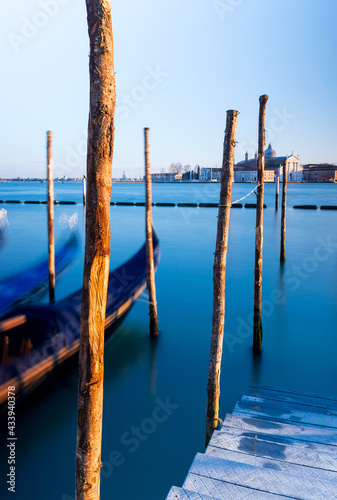 Gondolas and pier over Venice lagoon © Victoria Schaal