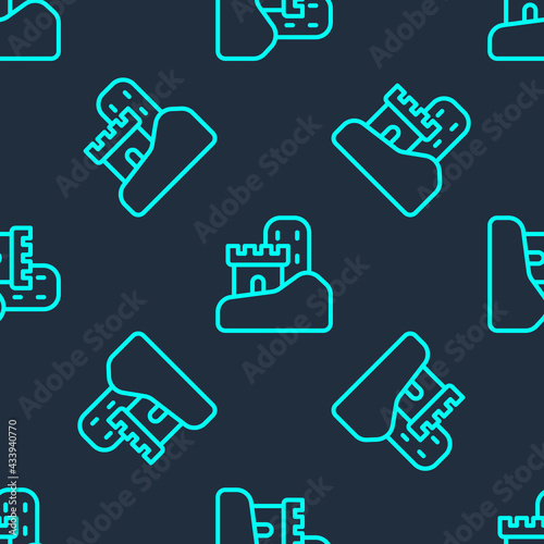 Green line Sand castle icon isolated seamless pattern on blue background. Vector © Kostiantyn