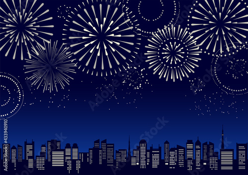 花火のあがる都市風景のイラスト（シルエット）