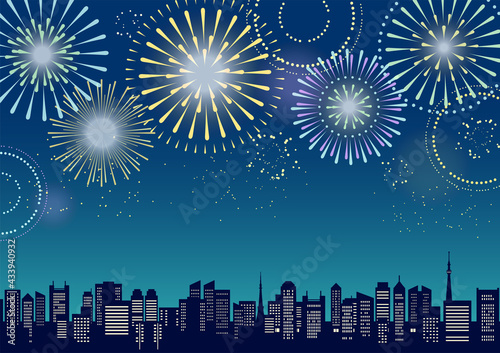 花火のあがる都市風景のイラスト（シルエット）