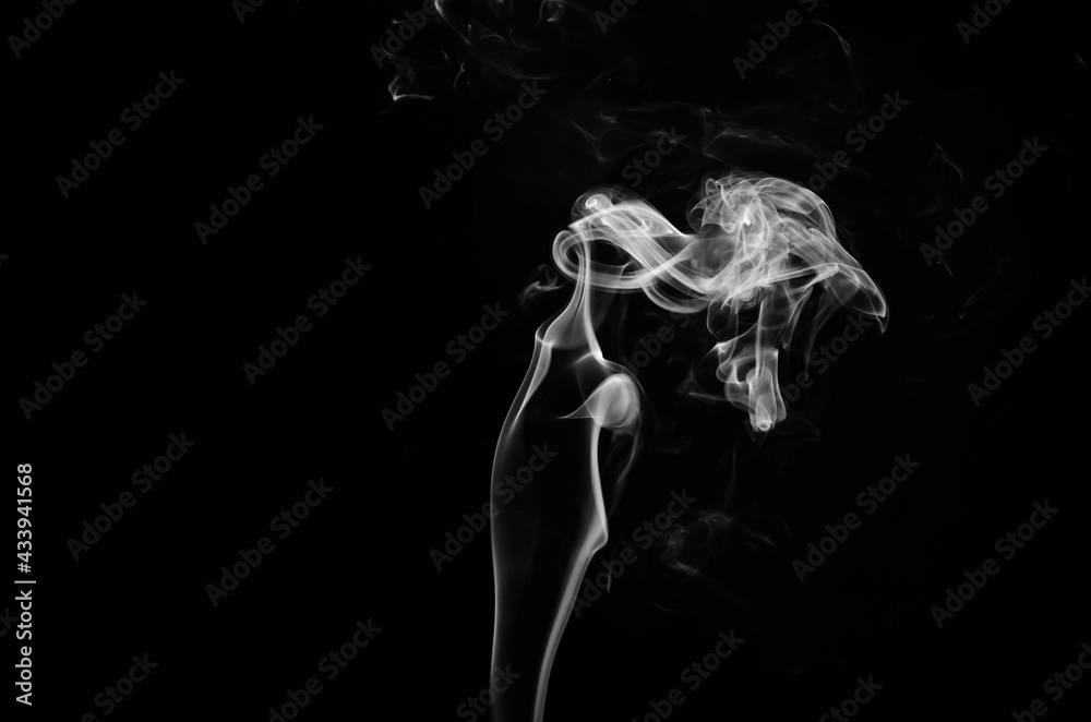 abstract fragment movement of white smoke on black background.