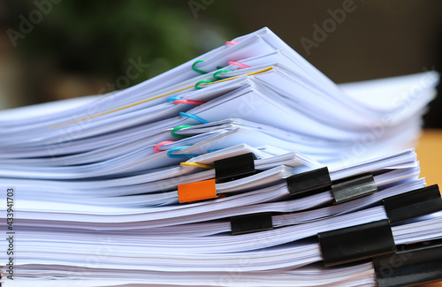 Closeup of a  pile of paper documents in office. 