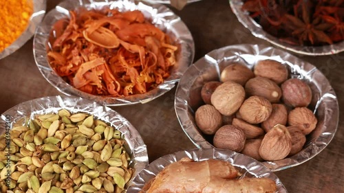 Variety of spices and herbs on kitchen table,cooking ingredients,spices and seasonings for cooking,Neroli,nutmeg, cinnamon, cloves, Anise,cardamom photo