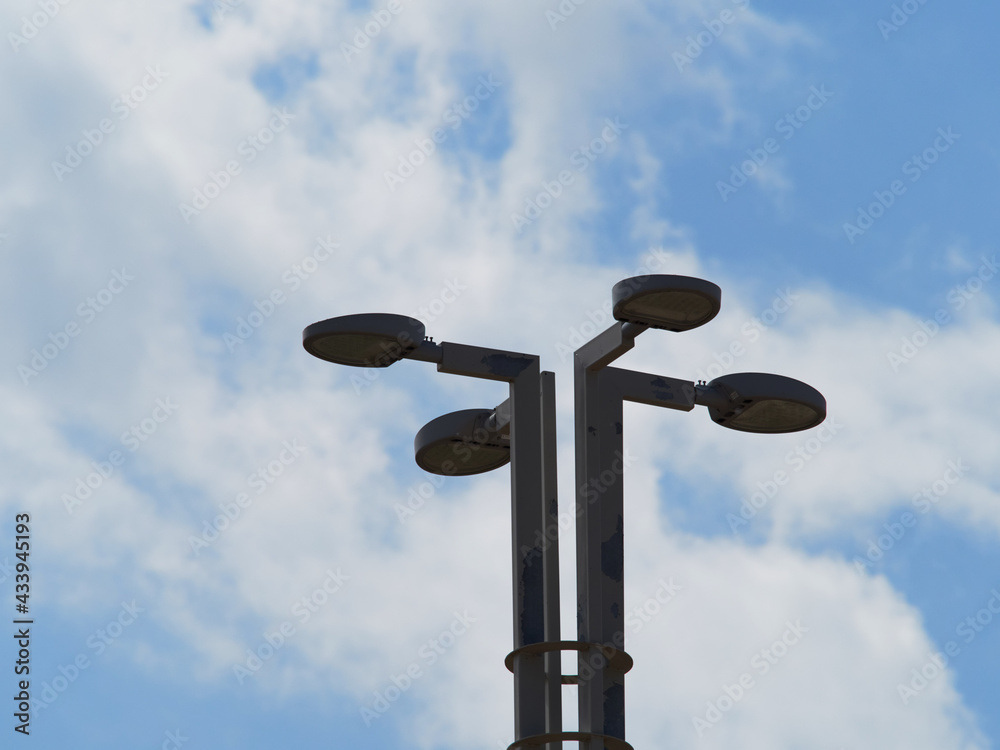 A modern lamp post under a beautiful blue sky A modern lamp post under a beautiful blue sky