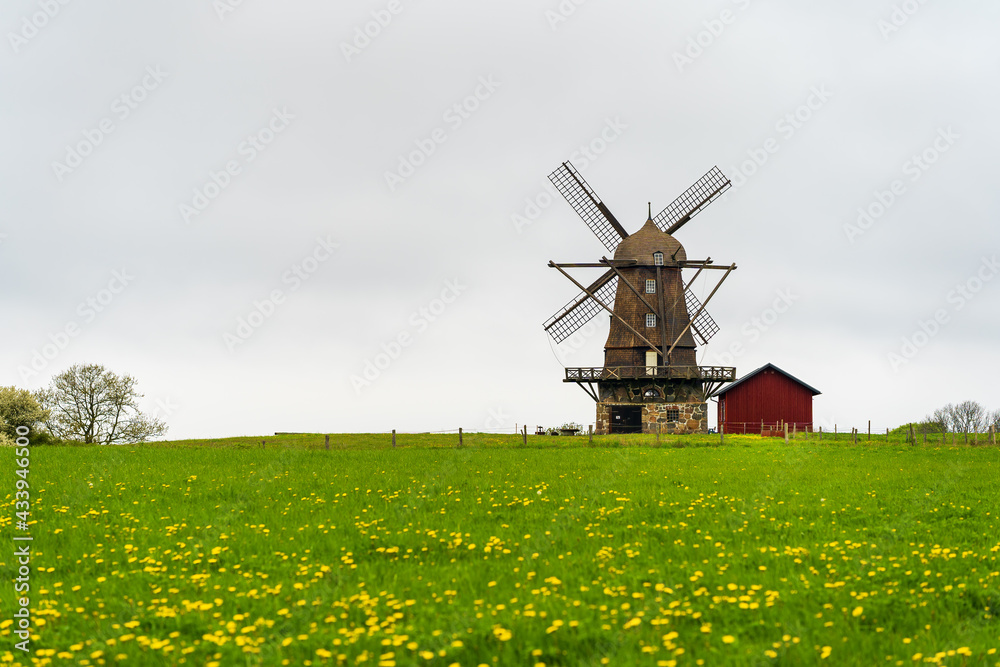 Traditional Dutch windmill on rural countryside. Selective focus.