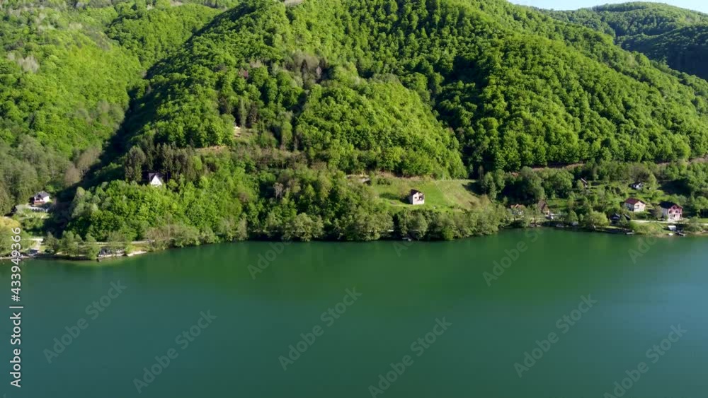 Beautiful green forest and lake in nature. Aerial drone view of lake in early spring. Beautiful green forest and lake in nature. Aerial drone view of lake in early spring.